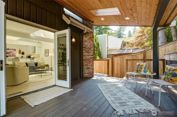 Outdoor Covered living space with skylights & lighting.