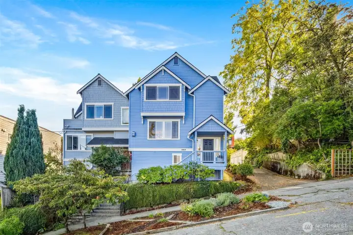 Two-townhouse complex with alley on a quiet tree-lined street