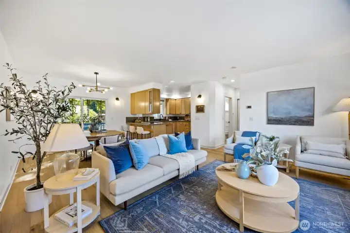 Open main level with gas fireplace, half bath, and covered porch.
