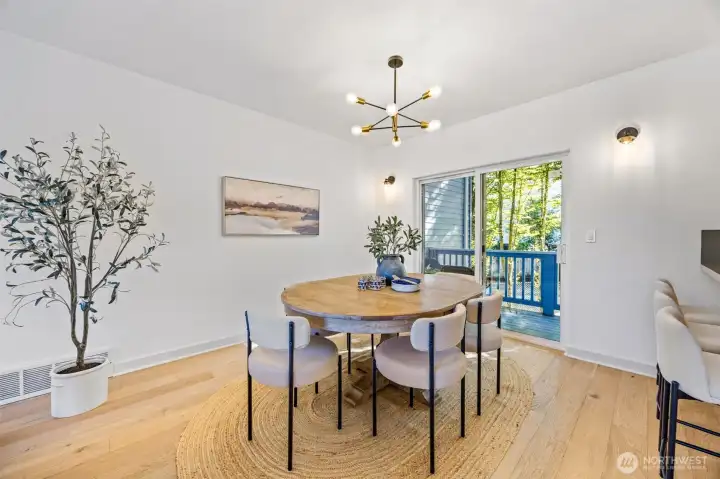 Open main level with gas fireplace, half bath, and covered porch.