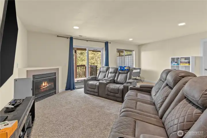 Huge lower level family room with fireplace