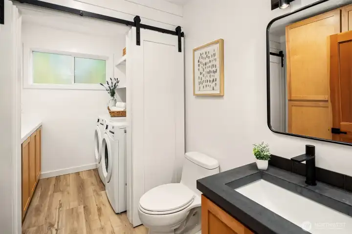 Main floor powder and laundry room.  Washer and dryer new in 2025