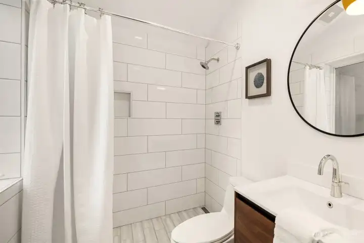 Primary bathroom has undergone a polished remodel