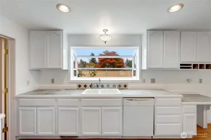 Big window in front of kitchen sink, great for natural light!