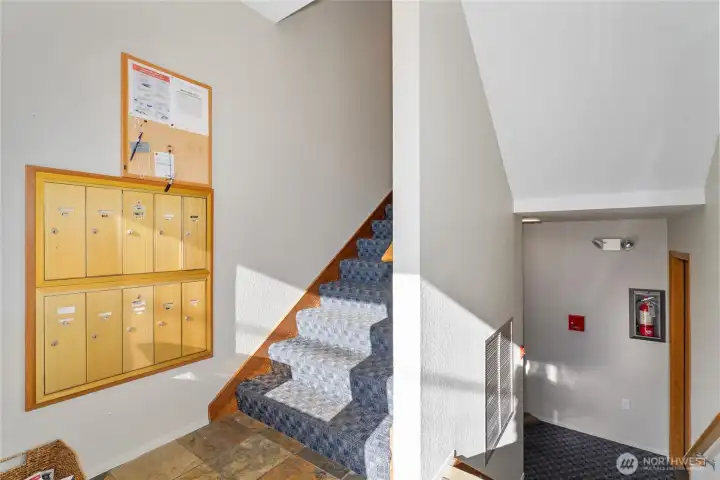 Secure private lobby entrance leading up to your unit or down to the garage.