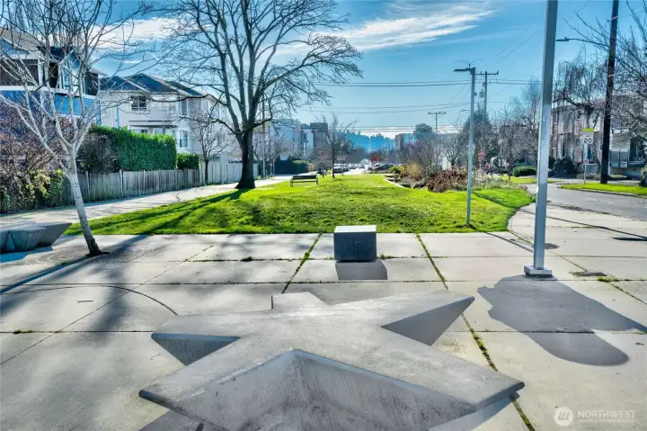 A lovely neighborhood "park" on 14th keeps traffic to a minimum and tranquility to a maximum.