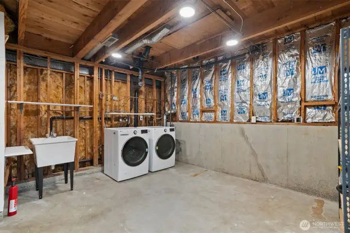 Laundry located on the lower main level. BRAND NEW washer and dryer stay!