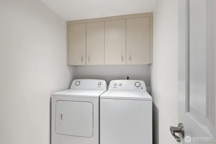 Dedicated Laundry Room with Storage!
