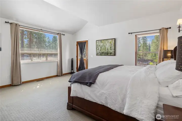 A sunlit primary bedroom that feels like your own private sanctuary.