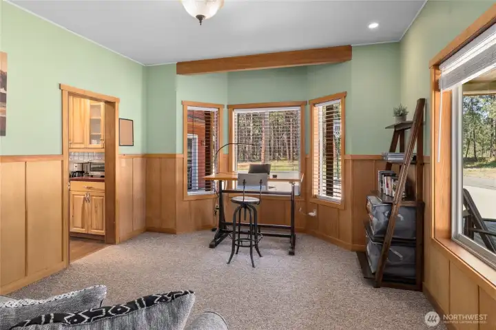 Sun-filled office that easily converts into a cozy additional sleeping area.