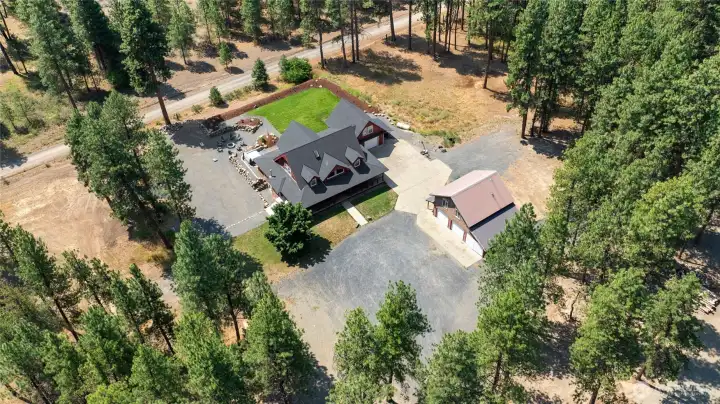 Enjoy 10 acres of level, usable land with a beautiful 4,400+ sq. ft. custom home and a detached shop ready for ADU possibilities.