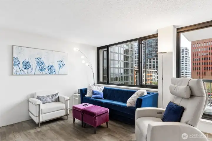 Living room is just off the entry & open to the dining room area. All living spaces in this unit have a view of the city, skyline or waterfront!