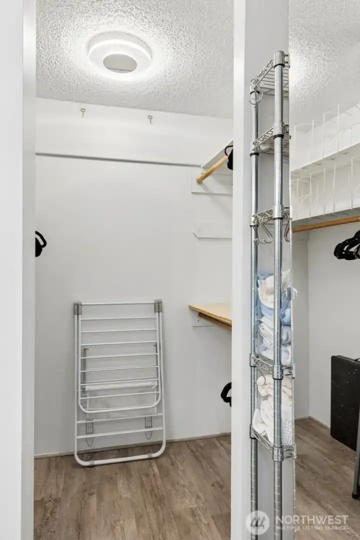 Primary bedroom walk-in closet.