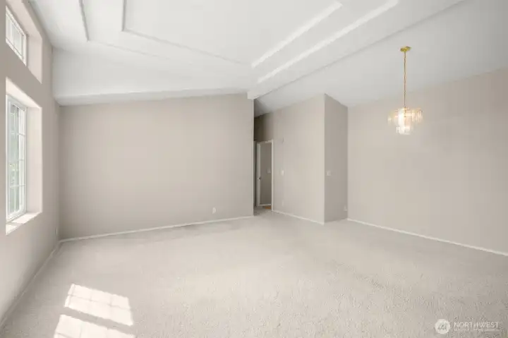 Large living room/formal dining area with cathedral ceilings.
