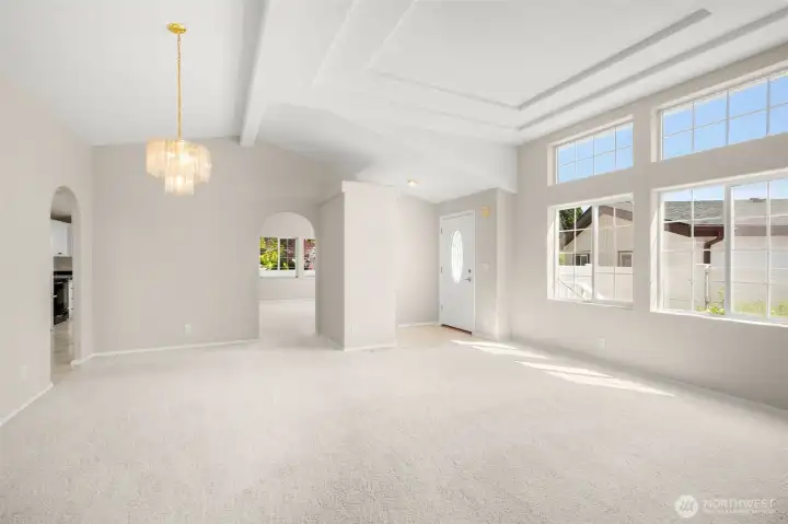 Another angle of large living room/formal dining area with cathedral ceilings.