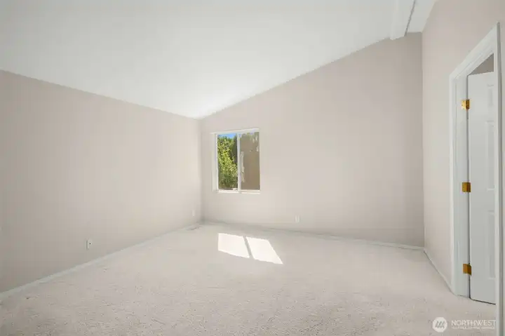 Primary bedroom with walk-in closet and large ensuite bath.