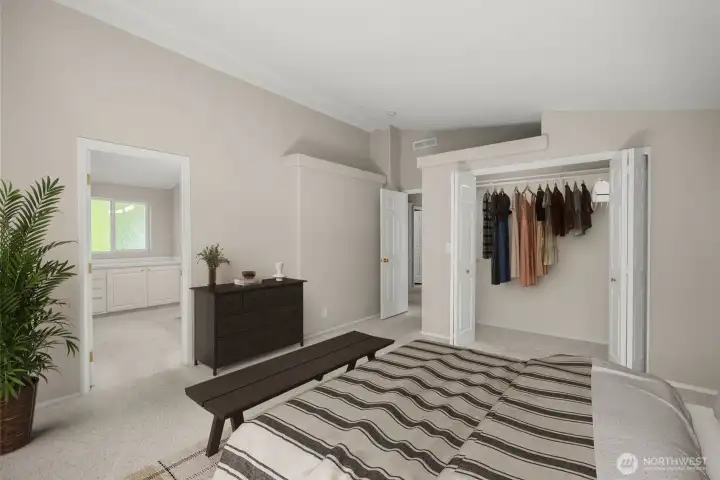 Primary bedroom with walk-in closet and large ensuite bath.