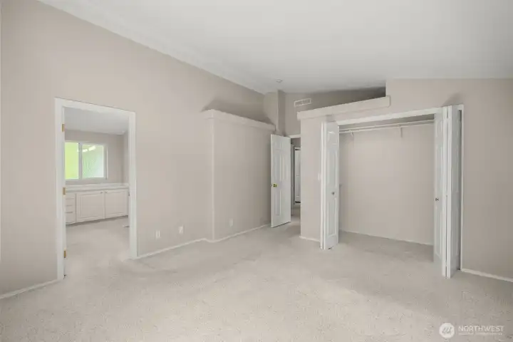 Primary bedroom with walk-in closet and large ensuite bath.