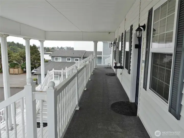 Front deck area with the entry door into #203. Front deck area with the entry door into #203.