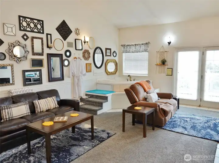 Relax in the Living Room with a hide-a-bed couch and jetted tub. Relax in the Living Room with a hide-a-bed couch and jetted tub.