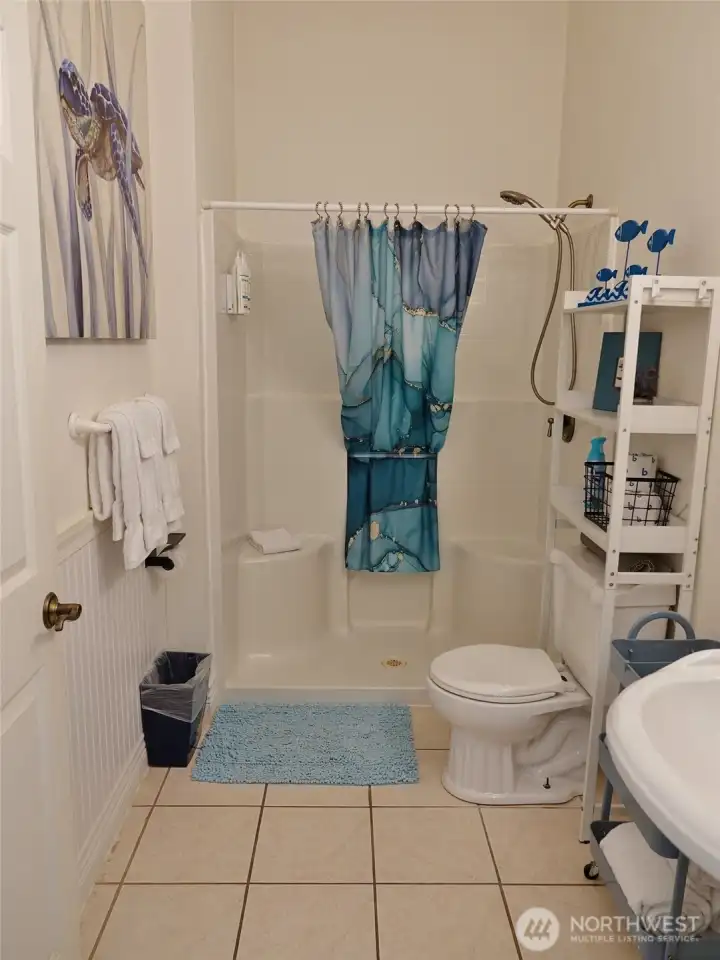 Spacious Bathroom w/ walk-in shower and tile floors. Spacious Bathroom w/ walk-in shower and tile floors.