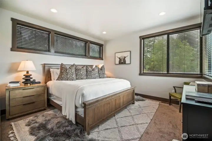 Main floor primary suite provides a quiet oasis