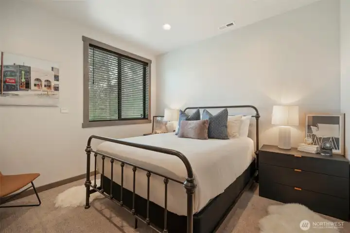 Downstairs bedroom for whoever likes to be away from the "crowd" when they sleep - there's a full bath on this floor as well