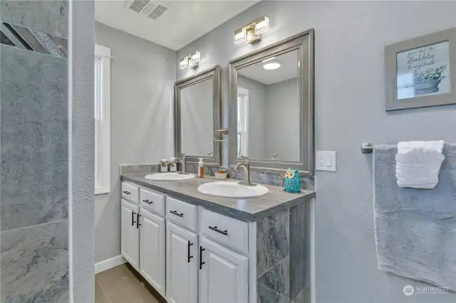 Large main floor bath is completely remodeled with two sinks.