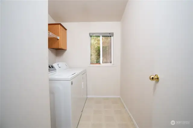 Large laundry room with more storage.