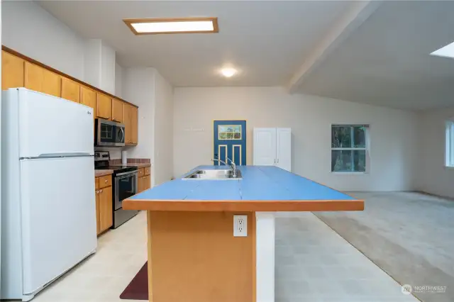 Kitchen/great room/dining area makes for inclusive living and fun entertaining.