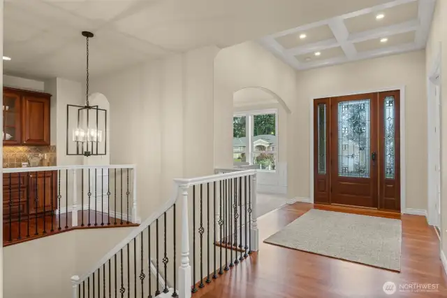 The moment you enter you'll be enveloped by Zetterberg signature quality and luxury design features such as the warm rich hardwoods in perfect condition, the coffered ceiling, wainscotting, and open staircase.