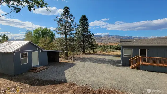 Outbuilding with carport