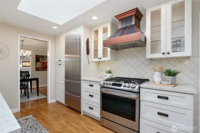 Gas stove with custom vent hood. Check out the skylight!