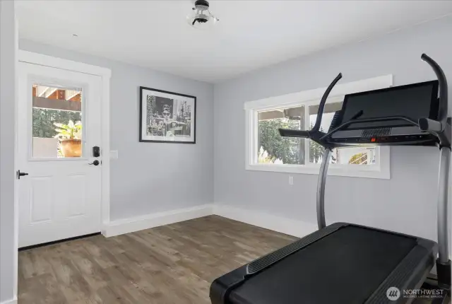Rec room on lower level w/ exterior access (being used as a gym).