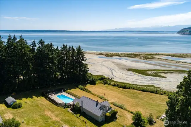 Community clubhouse, heated pool, yard, and beach.