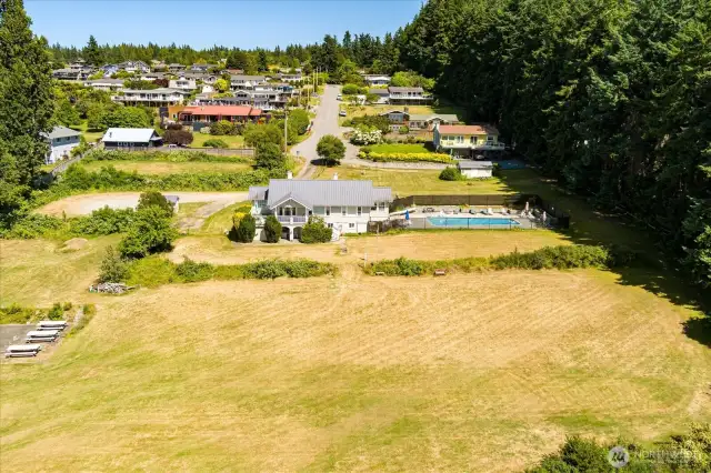 Community clubhouse, heated pool, yard, and beach.