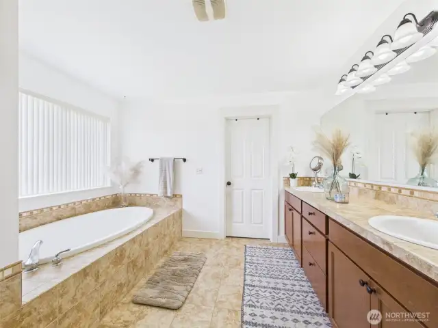 soaking tub in primary bedroom
