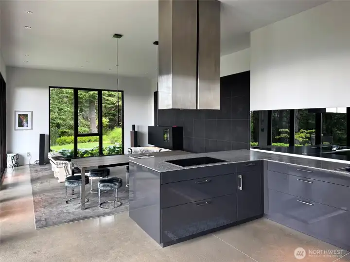 View when you enter living, dining and kitchen  space of home