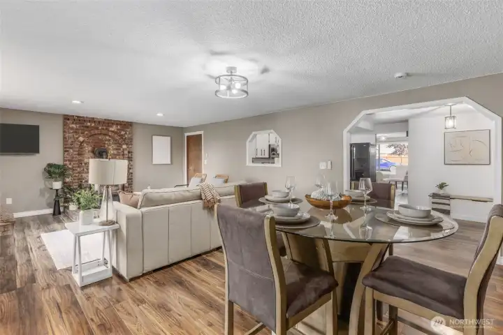 Beautiful brick accent surrounds gas fireplace in second living area