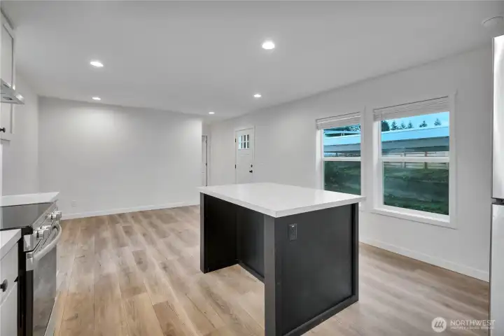 Large island with seating on both sides.