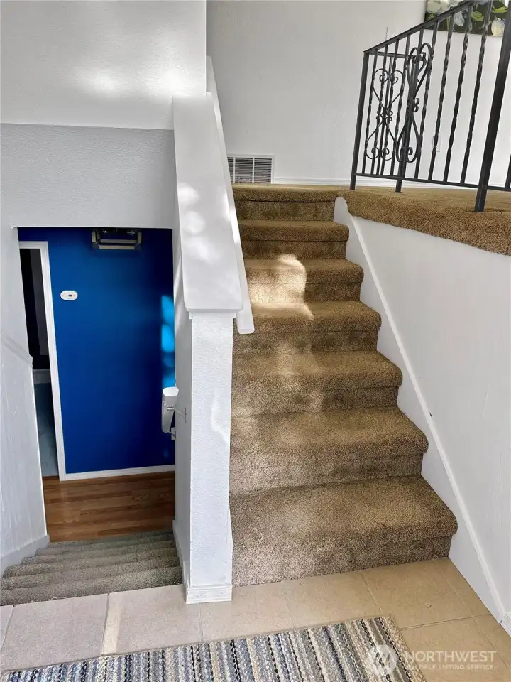 Entry, stairs up to main floor living kitchen and primary.  Lower-level features ample rec room, bath and 2 bedrooms + large laundry-pantry.