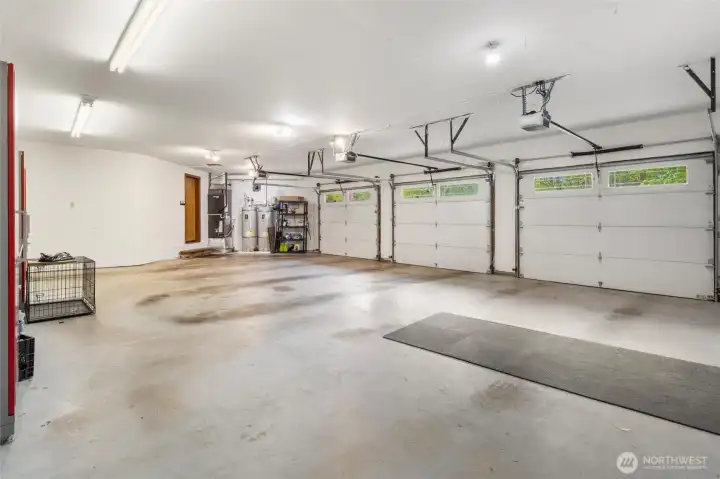 3-Car Garage with Dual Water Heaters and Tool Benches That Stay