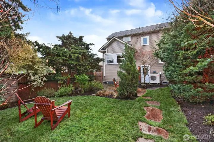 Outlook toward the back of house from the lovely, landscaped backyard.