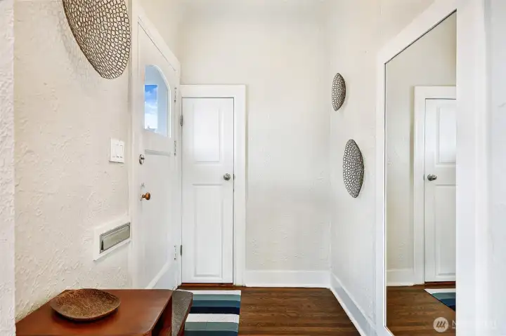Entry foyer with coat closet and mail slot!