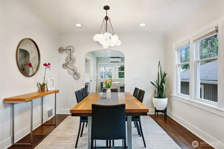Spacious formal dining room with hardwoods, coved ceiling and leaded glass windows.