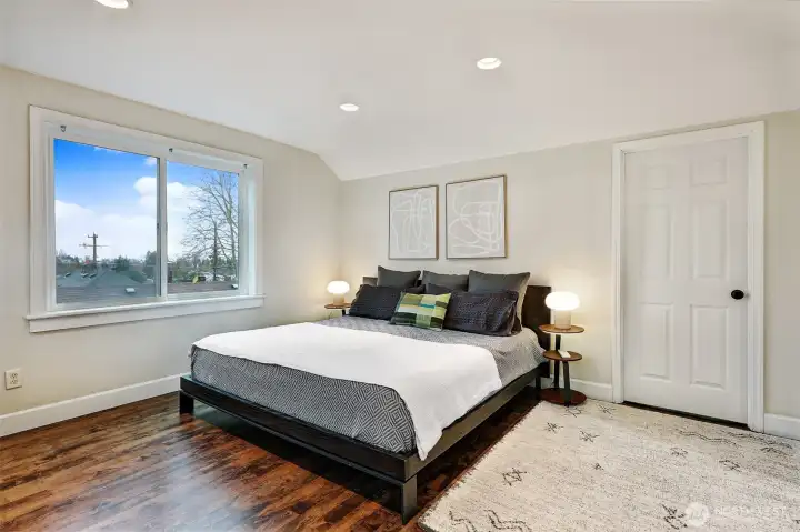 Beautiful primary bedroom on 2nd floor: light-filled with wood (maple) flooring, walk-in closet and ensuite bathroom.
