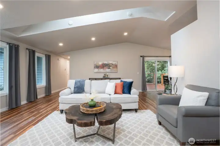Vaulted ceiling & skylight provides a spacious and open vibe to this tastefully refreshed RAMBLER!