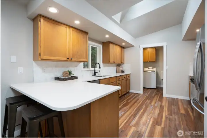 You will find loads of counterspace in the refreshed kitchen which are ideal for meal prep + a great space to gather.