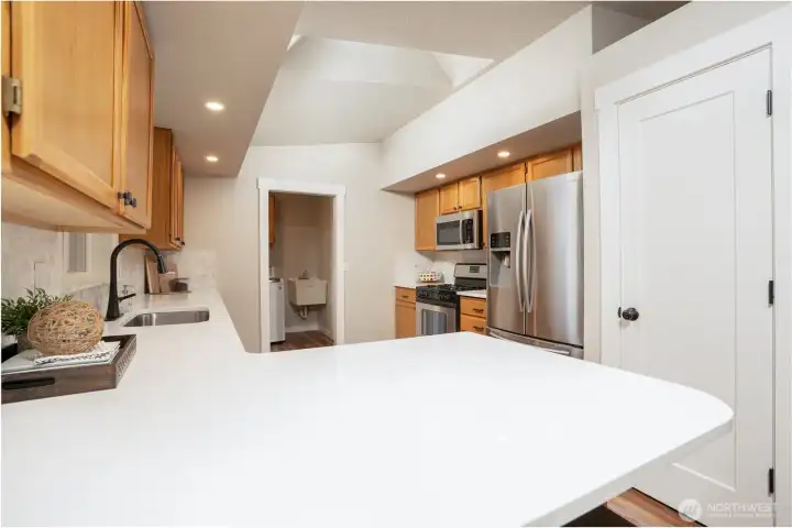 Refreshed kitchen offers stainless steel appliances, roomy peninsula island and a panty with a motion sensor light making it easy to see all your items.