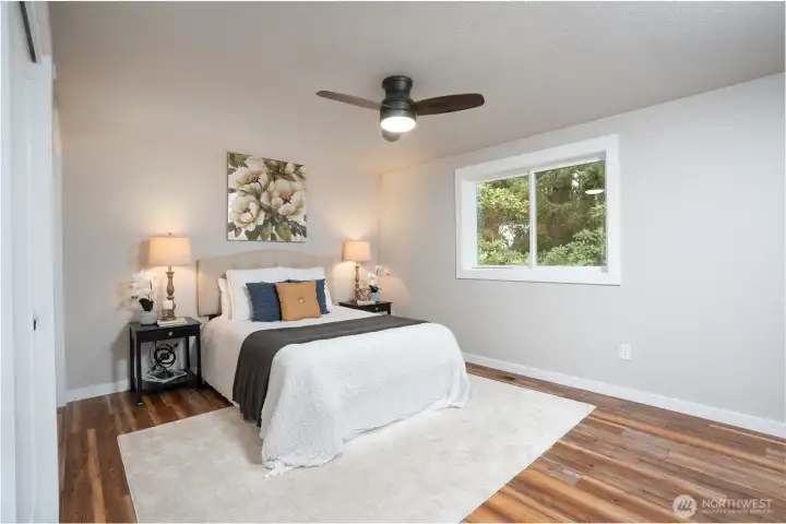 Primary en suite facing backyard for added privacy.